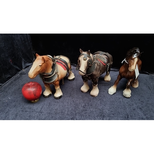 452 - Set of three Beswick pottery Shire horses with original harnesses, marked “Beswick England.”