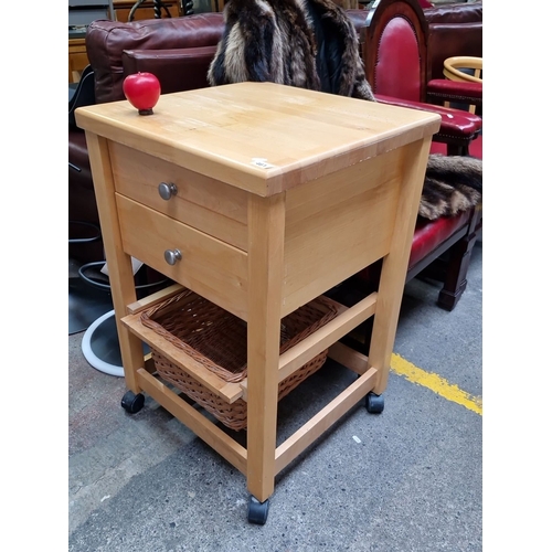 461 - Solid wood kitchen cart with two drawers, wicker basket storage, and rolling casters.