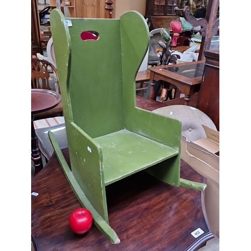 467 - Wooden rocking chair, painted green, from the mid-20th century. It features a cutout handle and a ca... 