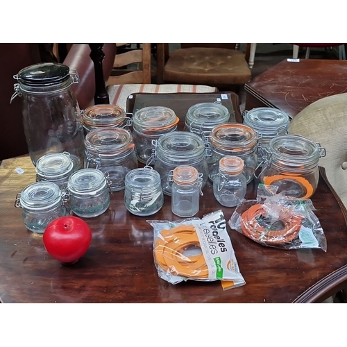 469 - Collection of 16 assorted glass preserving jars with clip-top lids, varying sizes, plus unused rubbe... 