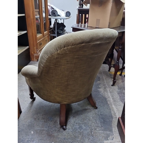 470 - Star Lot : Late Victorian upholstered armchair with button-tufted back, rolled arms, and mahogany ca... 