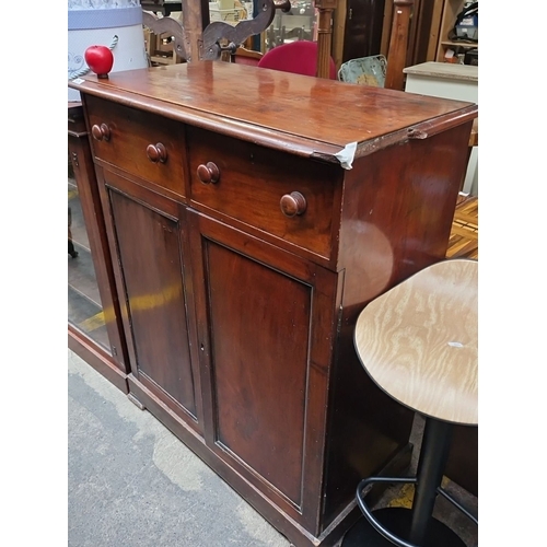 474 - Victorian mahogany sideboard features two drawers and dual cupboard storage with an updated interior... 