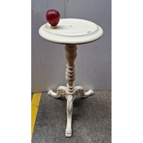 476 - Ornately carved pedestal table, vintage cream-painted finish with intricate scroll details, tripod b... 