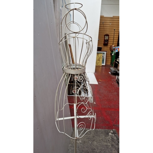 477 - Vintage white wrought iron dress form mannequin features elegant scrollwork design and sturdy constr... 