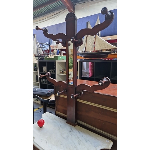 498 - Star Lot : A Victorian mahogany Tree hall stand with marble top, central mirror, and turned coat hoo... 