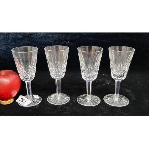 201 - A set of four Waterford Crystal stemmed glasses in the Lismore pattern. In good condition with acid ... 