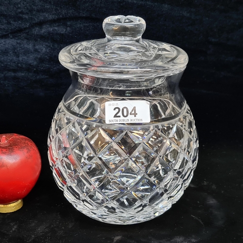 204 - A large Waterford Crystal lidded jar. Very Slight nibbles to interior of lid. Acid mark to base.