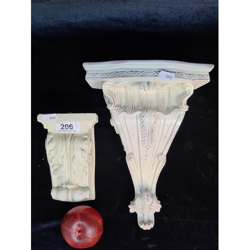 206 - A pair of fabulous antique corbels in a white painted finish.