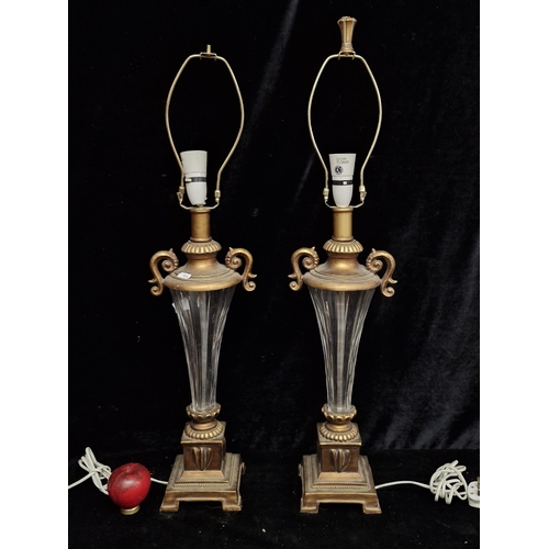 224 - Star Lot : A pair of tall elegant cut glass table lamps with classical design, A/F. These are from t... 