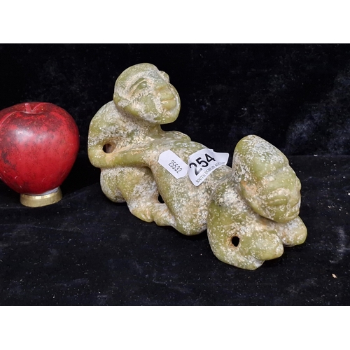 254 - Star lot :An evocative Erotic vintage green jade hand carved sculpture. Cold to the touch and heavy