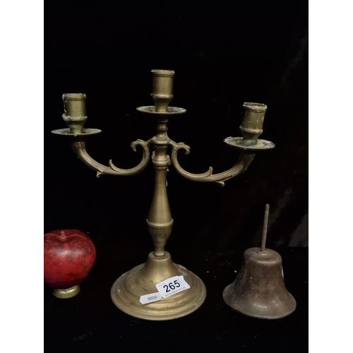 265 - Two antique brass items including a three light candelabra and English made bell.