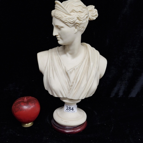 284 - A bust of Diana after Leochares on wooden base.