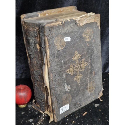 296 - A large mid 19th century copy of The Holy Bible by The Rev. Geo Leo Haydock. Leather bound. Has suff... 