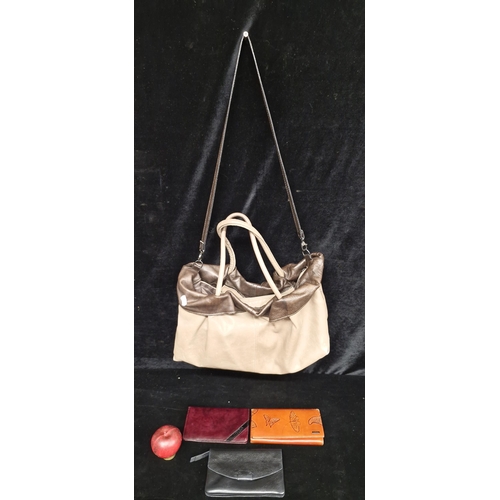 299 - A gorgeous soft leather Mariella Rosati hand bag along with three vintage leather purses.