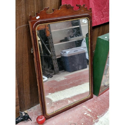 364 - A tall handsome Victorian mirror boasting a nicely carved gallery and gilt surround to glass. MM 93c... 