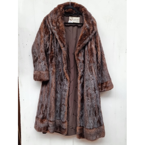 373 - Star lot : A beautiful vintage Barnardo Dublin genuine fur longline coat in brown. Size approx. medi... 