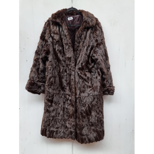 374 - Star lot : A stunning vintage genuine fur longline coat. Approx. size medium.