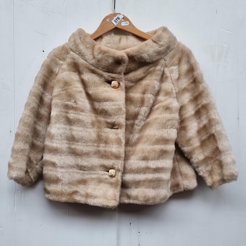 376 - A vintage ladies cropped beige faux fur jacket 'Styled by Winter'. Size medium.
Some staining to nec... 