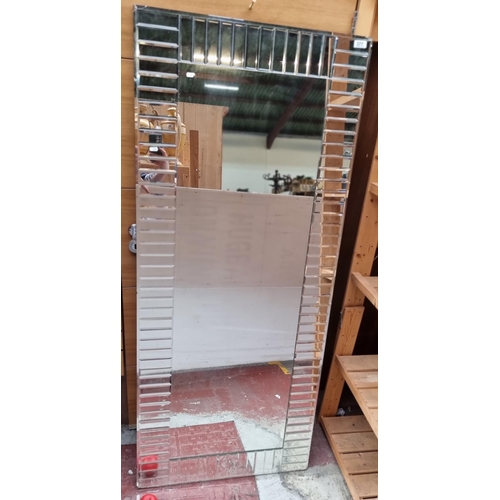 377 - A large contemporary modern mirror with bevelled glass mirrored panels. very small crack on one corn... 