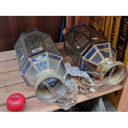 380 - A fab pair of hanging lantern style light fixtures made of brass and bevelled clear glass panels, al... 