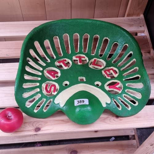 389 - A Satley hand painted heavy cast iron tractor seat.