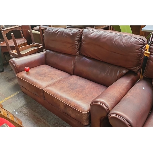 636 - Star Lot : A very handsome, clean Modern brown leather three-piece lounge suite, including a two-sea... 