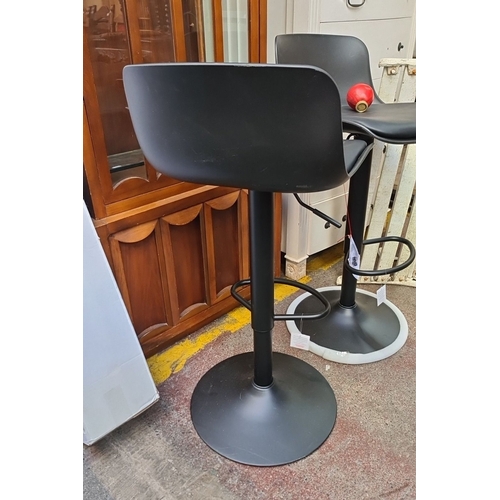 638 - Pair of brand new modern black adjustable bar stools with sleek contoured seats and metal pedestal b... 