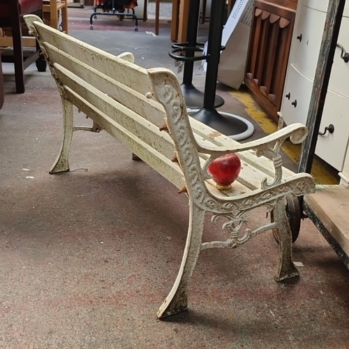 639 - Star Lot : A fabulous Childs Victorian garden bench with ornate cast iron sides wooden slats. From t... 