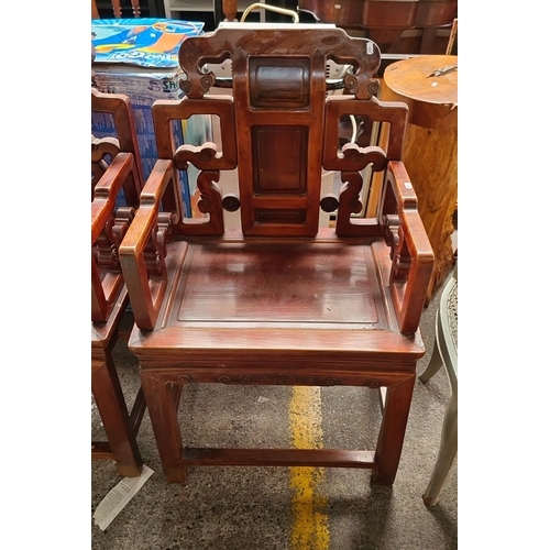 660 - Star Lot : A fabulous Pair of intricately carved Chinese-style hardwood armchairs, featuring openwor... 