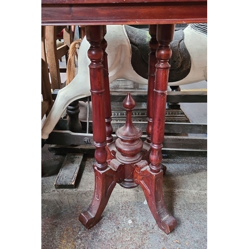 668 - Victorian-style mahogany side table with turned supports and scalloped platform base. From the Drawi... 