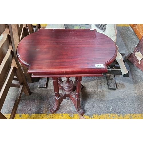 668 - Victorian-style mahogany side table with turned supports and scalloped platform base. From the Drawi... 