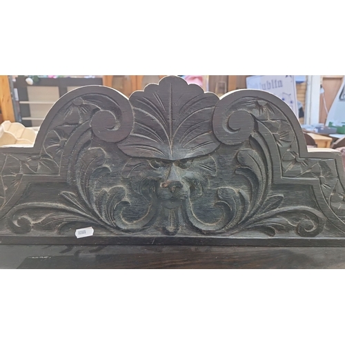 670 - Star Lot : A Victorian carved oak ebonies  dumb waiter  with lion motif, barley twist supports, and ... 