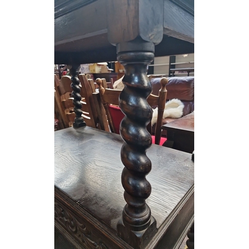 670 - Star Lot : A Victorian carved oak ebonies  dumb waiter  with lion motif, barley twist supports, and ... 