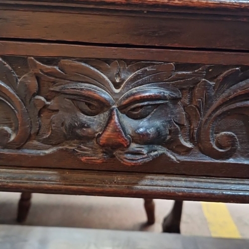 670 - Star Lot : A Victorian carved oak ebonies  dumb waiter  with lion motif, barley twist supports, and ... 