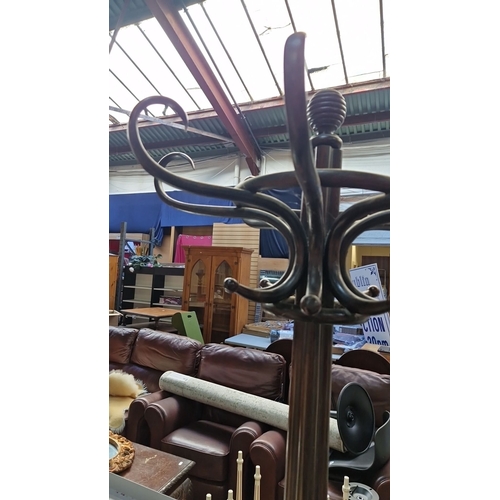 673 - Star Lot : A Large oversized Antique bentwood coat stand, featuring ornate curved arms and tripod ba... 