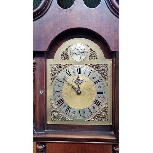 681 - Star Lot : A good looking Mahogany longcase clock features brass weights and pendulum, a classic arc... 