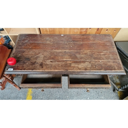 683 - Star Lot : An early Antique plank console table with carved detailing, two spacious drawers, and tur... 