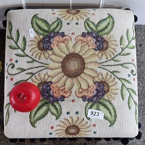 923 - Vintage embroidered footstool with cast metal legs, features a floral tapestry top with decorative t... 