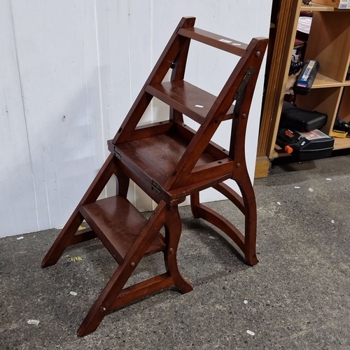 927 - A fabulous mahogany metamorphic library chair converts into a step ladder.