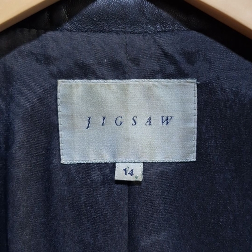 930 - Star Lot: A stunning JIGSAW designer black leather coat, size 14, mid-length design with classic lap... 