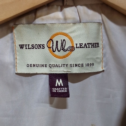 931 - Wilsons Leather cream-colored jacket, size medium, crafted from genuine leather with a tailored fit ... 