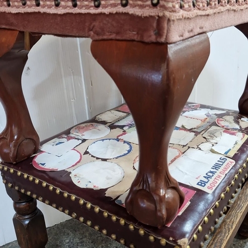 965 - two vintage upholstered and studded foot stools, one with claw feet.