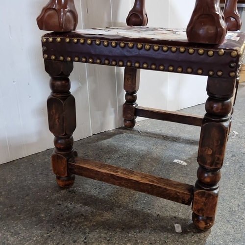 965 - two vintage upholstered and studded foot stools, one with claw feet.