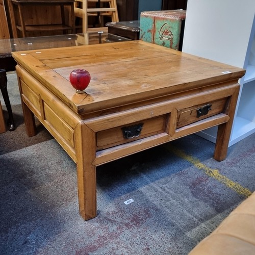 1021 - A vintage rustic pine square coffee table with two pull out drawers and metal drop leaf handles.
Pre... 