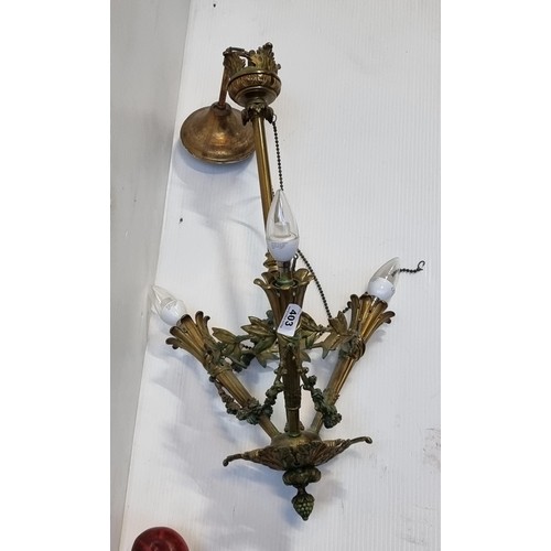 1022 - An elaborate antique brass three branch pendant ceiling light. Some light attention needed to one pa... 