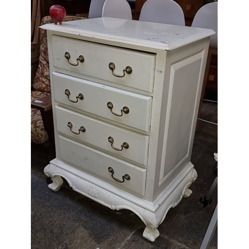 1025 - A painted French style chest of drawers. Features carved detailing to base with ball and claw feet a... 