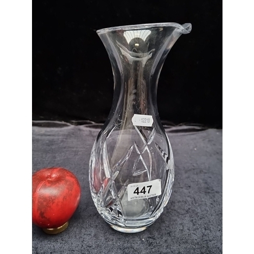 447 - A John Rocha for Waterford Crystal vase featuring an elegant curved design. In good condition with a... 