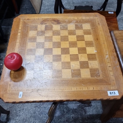 1142 - Star Lot : A Victorian inlaid wood games table with chessboard top design, supported by a turned ped... 