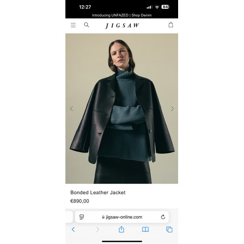 930 - Star Lot: A stunning JIGSAW designer black leather coat, size 14, mid-length design with classic lap... 