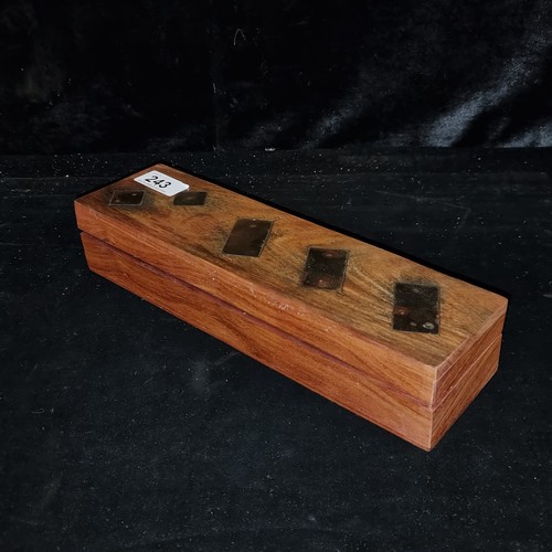 243 - A handsome wooden dominoes and dice game box set with brass detailing.